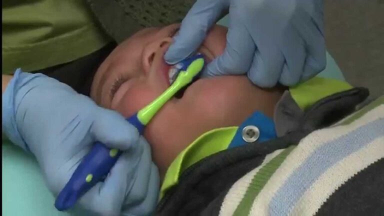Tooth Brushing for children three and under – The knee-to-knee technique